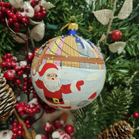 SANTA AND LADY LIBERTY SNOWBALL FIGHT GLASS BALL