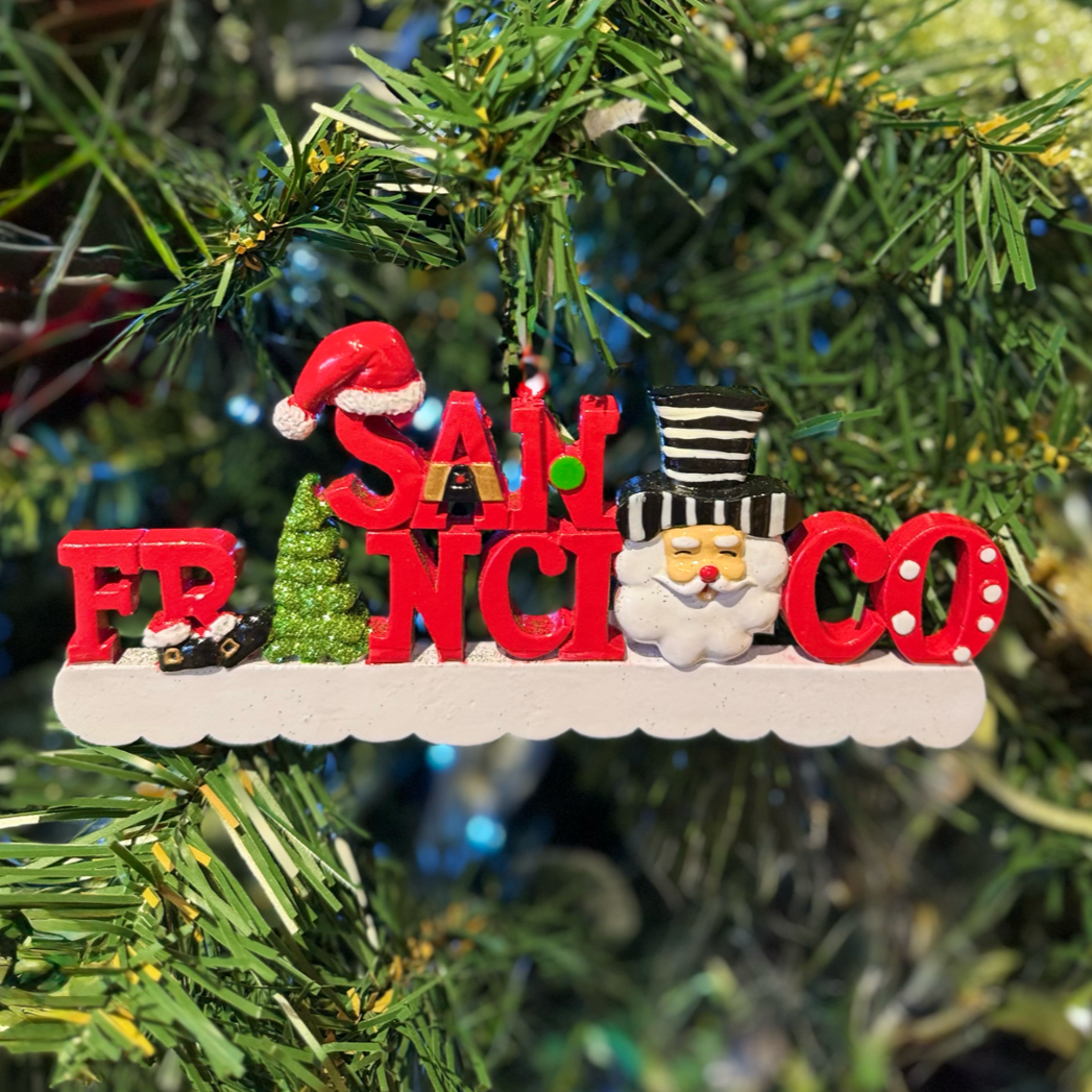 Christmas ornament with 'San Francisco' on a decorated tree