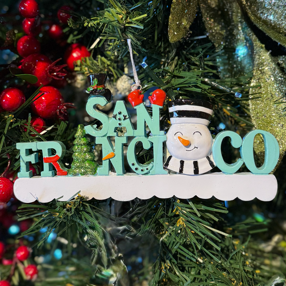 Christmas ornament with 'San Francisco' on a decorated tree