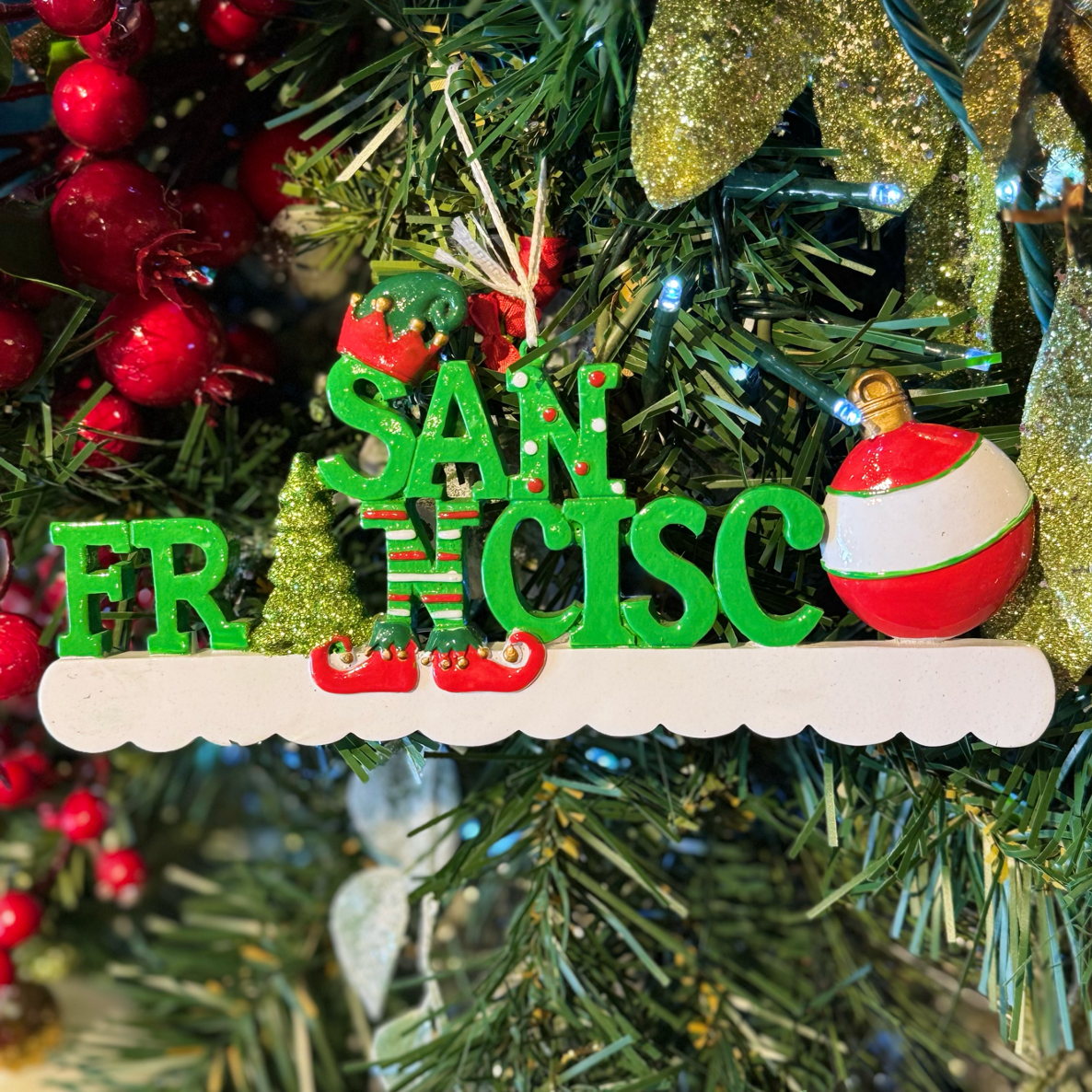 Christmas ornament with 'San Francisco' on a decorated tree